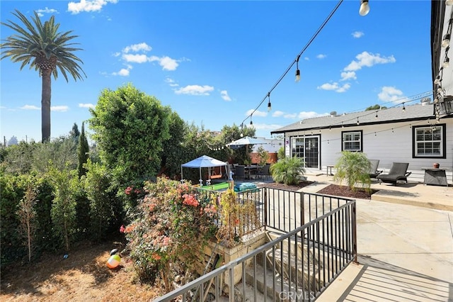 exterior space featuring a pool and a patio