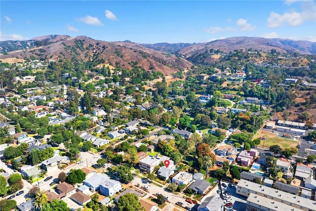 birds eye view of property with a mountain view