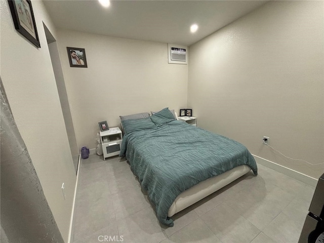 bedroom featuring a wall mounted air conditioner