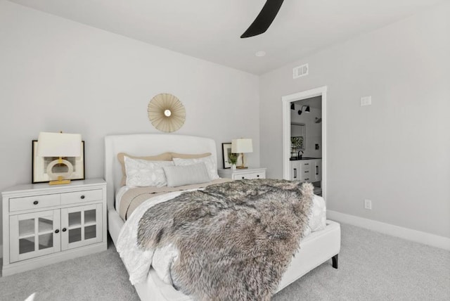 carpeted bedroom featuring sink and ceiling fan