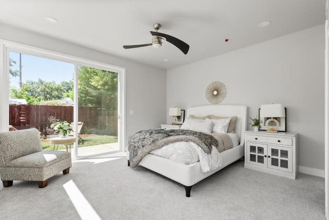 bedroom featuring ceiling fan, light colored carpet, and access to outside