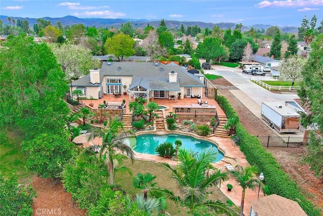 birds eye view of property with a mountain view