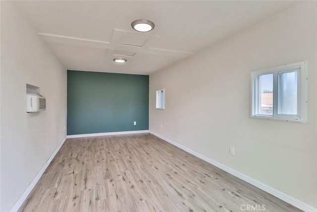 spare room featuring light hardwood / wood-style floors