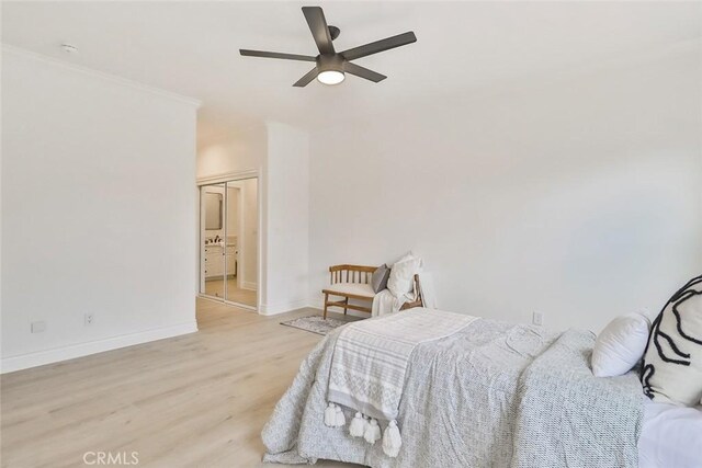 bedroom with light hardwood / wood-style flooring and ceiling fan