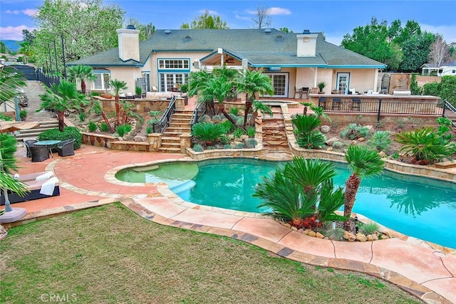 view of pool featuring a patio area