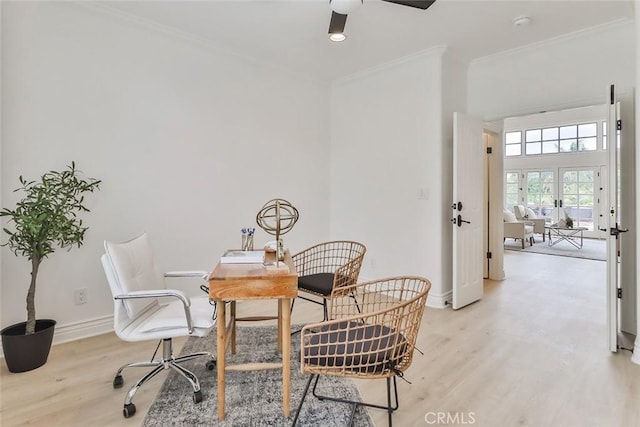 interior space featuring crown molding, light hardwood / wood-style flooring, and ceiling fan