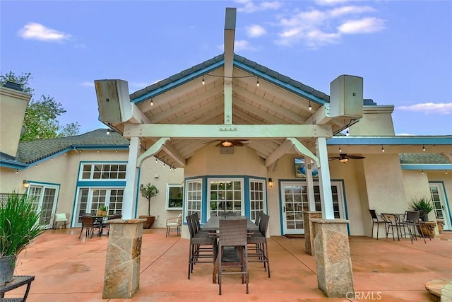 back of property with a bar, a gazebo, a patio, and ceiling fan