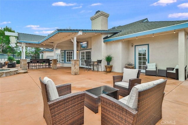 view of patio featuring an outdoor living space and ceiling fan