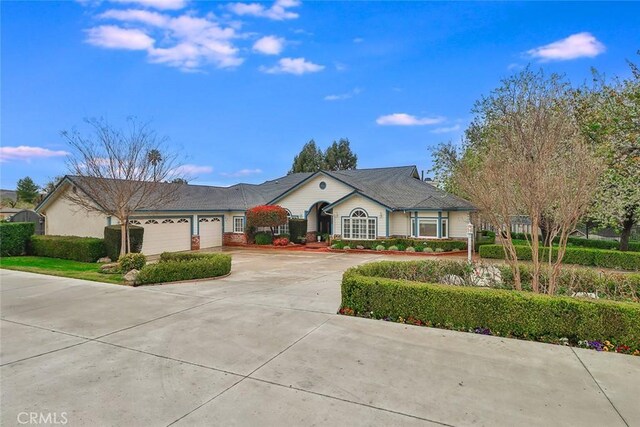 ranch-style house featuring a garage