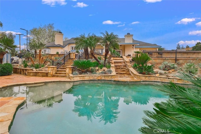 view of swimming pool with a patio