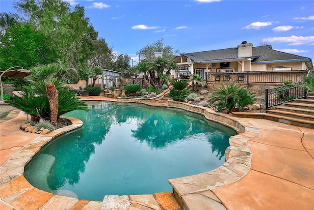 view of swimming pool with a patio area