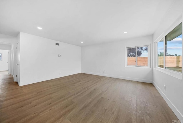 empty room featuring hardwood / wood-style flooring