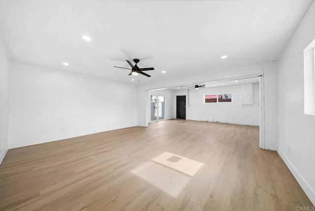 unfurnished living room with light hardwood / wood-style floors and ceiling fan