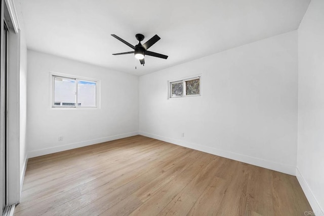 unfurnished room featuring light hardwood / wood-style flooring and ceiling fan