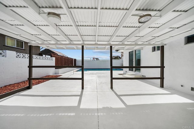 view of patio / terrace with a fenced in pool