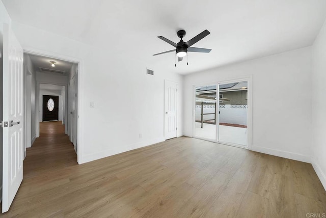 spare room featuring ceiling fan and light hardwood / wood-style floors