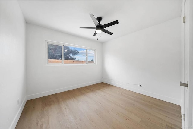 spare room with ceiling fan and light wood-type flooring