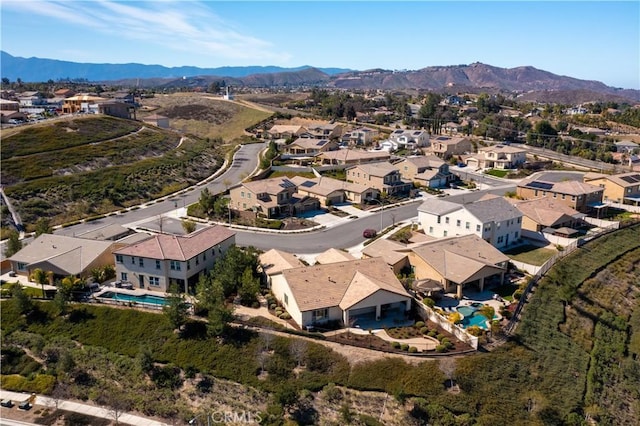 bird's eye view featuring a residential view and a mountain view