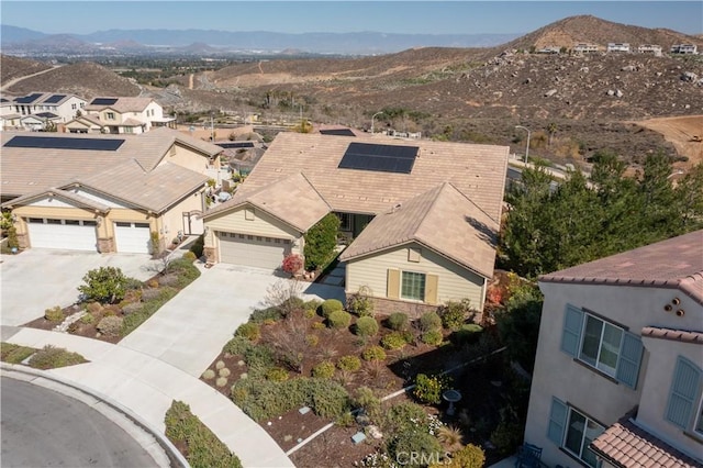 aerial view featuring a mountain view and a residential view