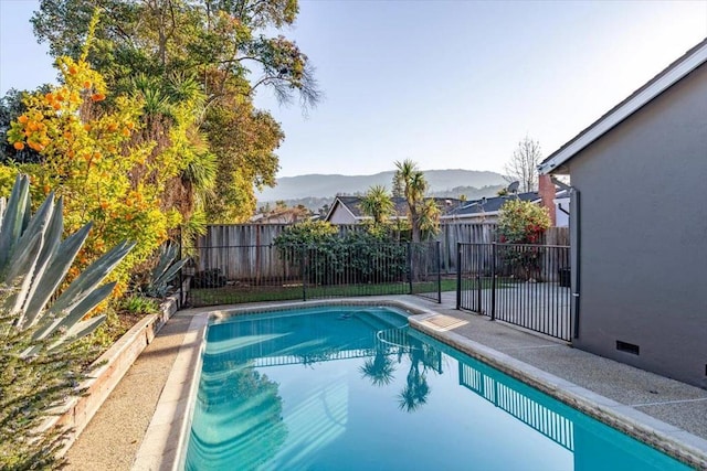 view of swimming pool featuring a mountain view