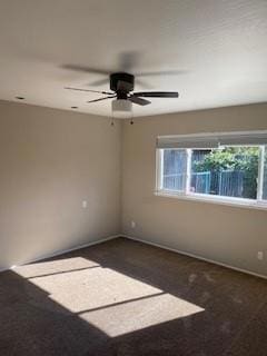 spare room with ceiling fan