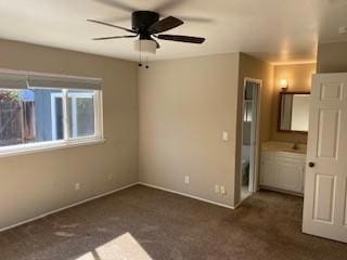 unfurnished bedroom featuring dark colored carpet