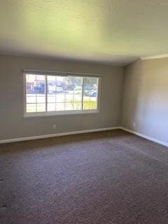 unfurnished room with plenty of natural light and dark colored carpet