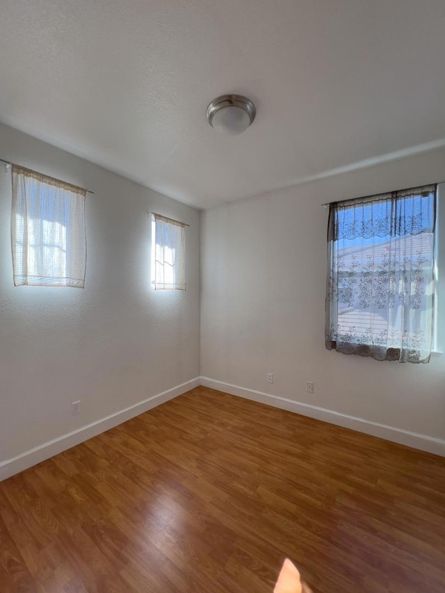 empty room featuring hardwood / wood-style floors