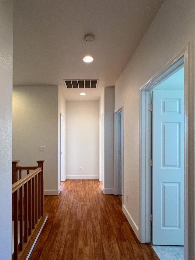 corridor featuring hardwood / wood-style floors