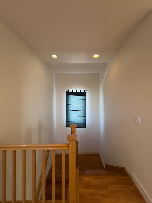 stairs with wood-type flooring