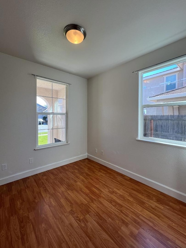 empty room with wood-type flooring