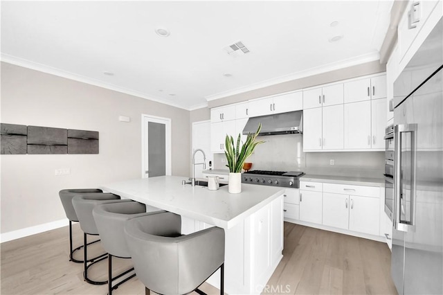 249 Chorus, Irvine, CA 92618 - kitchen featuring a sink, stainless steel gas cooktop, visible vents, and light wood-style floors