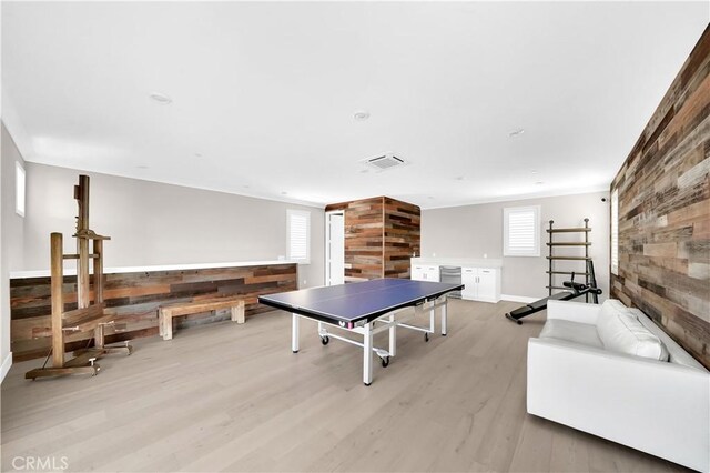 249 Chorus, Irvine, CA 92618 - game room featuring wooden walls, visible vents, a healthy amount of sunlight, and light wood-style floors