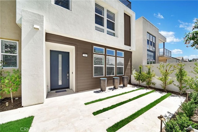 249 Chorus, Irvine, CA 92618 - back of house featuring stucco siding and fence