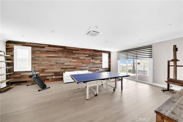 249 Chorus, Irvine, CA 92618 - recreation room with baseboards, wooden walls, visible vents, and wood finished floors