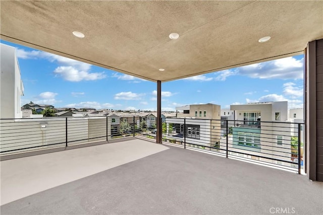 view of patio featuring a balcony