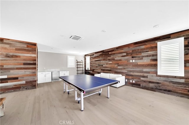 249 Chorus, Irvine, CA 92618 - playroom featuring wooden walls, light wood-style flooring, and visible vents