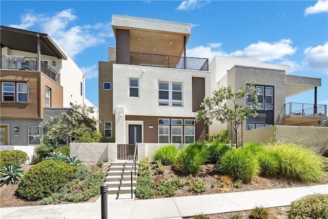 249 Chorus, Irvine, CA 92618 - view of front facade with fence and stucco siding