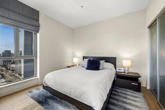 bedroom with hardwood / wood-style floors