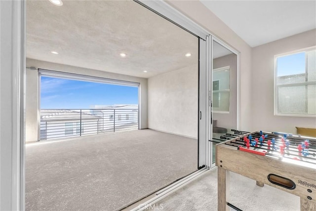 game room featuring a wealth of natural light, carpet flooring, and recessed lighting