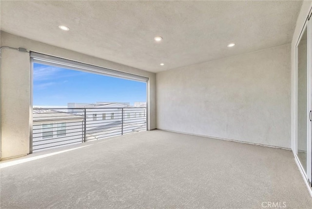 unfurnished room featuring carpet and recessed lighting