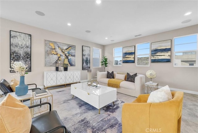 carpeted living area featuring recessed lighting, visible vents, and baseboards