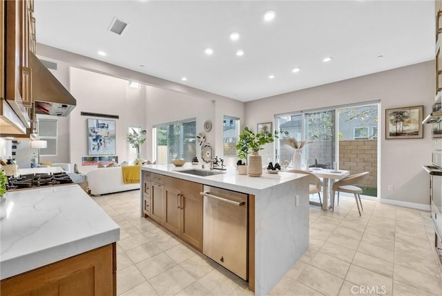 kitchen with visible vents, dishwasher, open floor plan, a sink, and recessed lighting