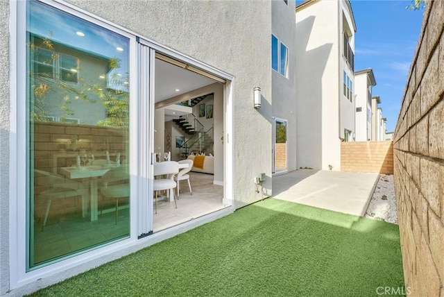 exterior space featuring a patio area and fence