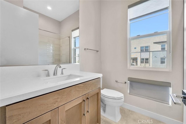 bathroom featuring vanity, walk in shower, toilet, and tile patterned floors