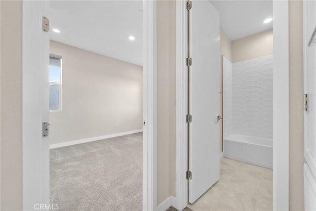 corridor featuring carpet floors, recessed lighting, and baseboards