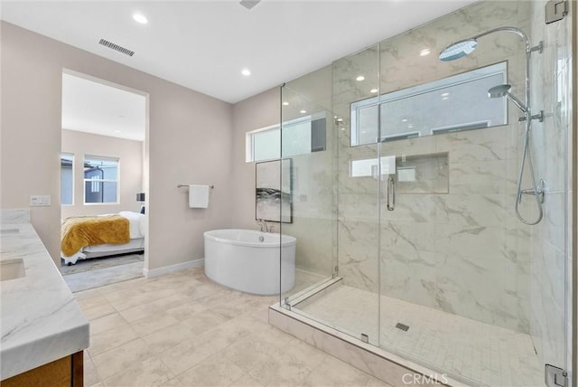 ensuite bathroom with connected bathroom, vanity, visible vents, a soaking tub, and a marble finish shower