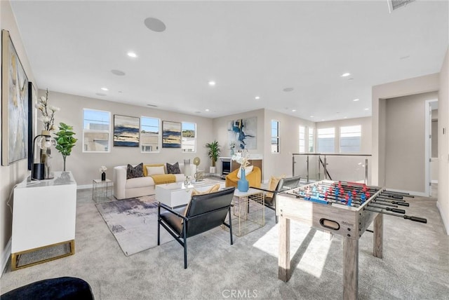 living room featuring carpet, baseboards, and recessed lighting