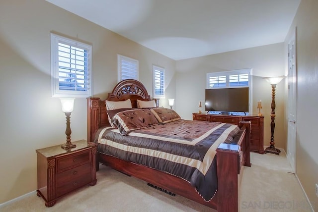 bedroom with light carpet