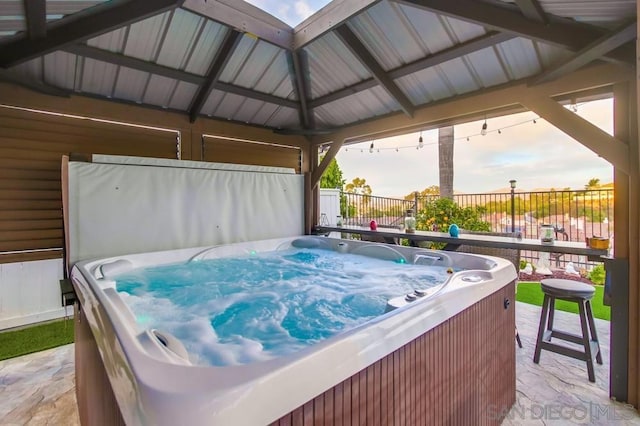 view of patio featuring a gazebo and a hot tub